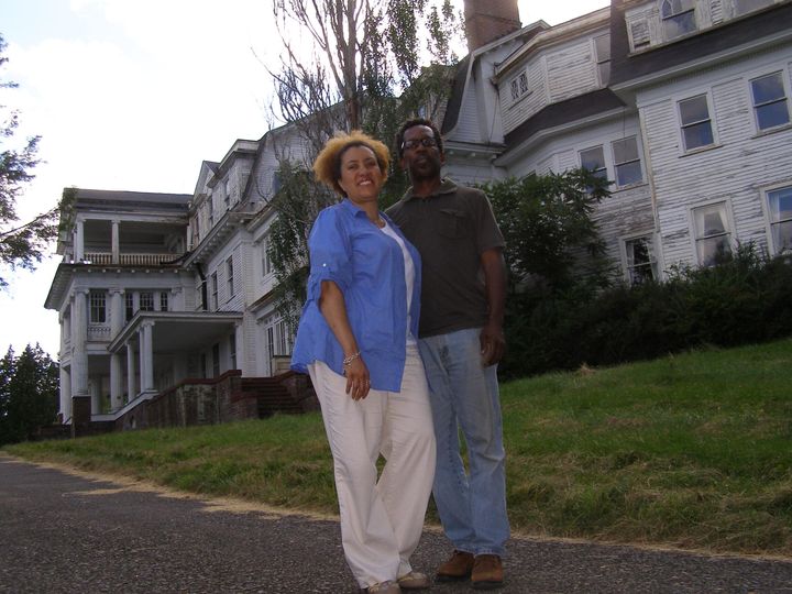 Monique Greenwood and Glenn Pogue in front of The Mansion at Noble Lane right after the purchase in 2011, before the restoration (as pictured below). Akwaaba Bed & Breakfast Inns is the upscale lodging collection owned by husband and wife team. 