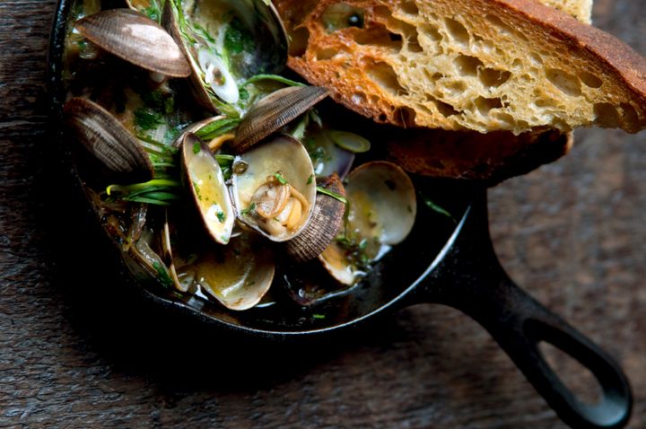 Clams cooked in sherry, served with green garlic and toast