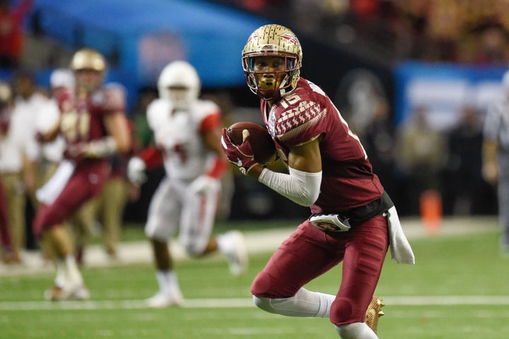 Florida State Seminoles wide receiver Travis Rudolph (15) carries the ball to score a touchdown.