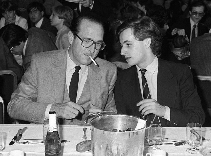 Paris Mayor Jacques Chirac, left, speaks with Nicolas Sarkozy, 26, on March 24, 1981. At the time, Chirac was president of the Rally for the Republic party and Sarkozy was in charge of its youth division. Sarkozy ended up succeeding Chirac as president in 2007.