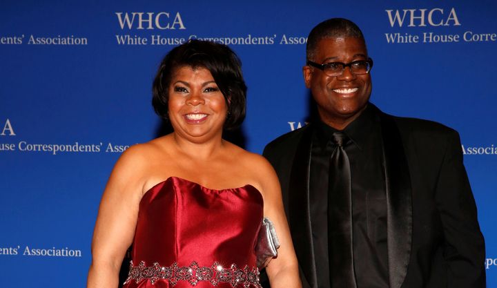 Radio reporter April Ryan, left, arrives on the red carpet at the White House Correspondents' Association dinner.