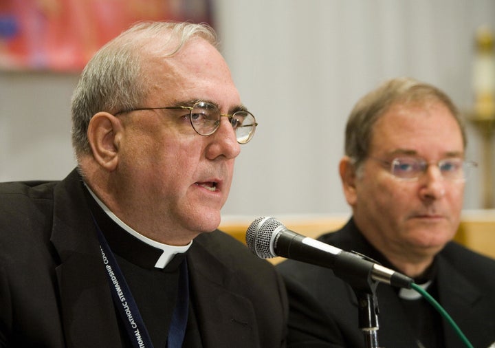 The archbishop of Kansas City, Kansas, Joseph Naumann (left).