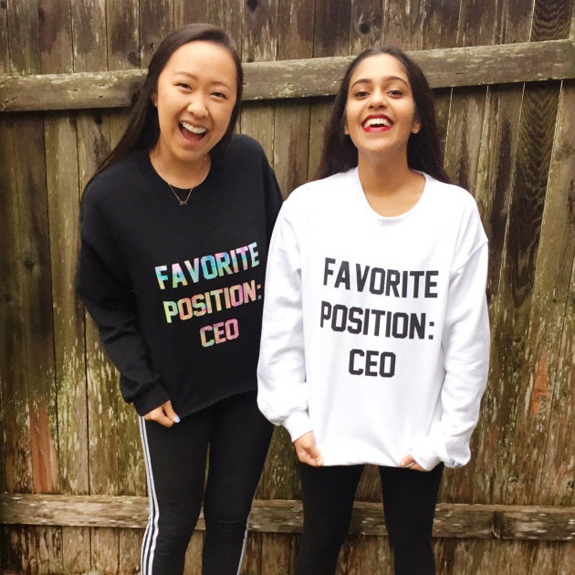 <em>Angela Jin and Nishiki Maredia model sweatshirts of their own design. </em>