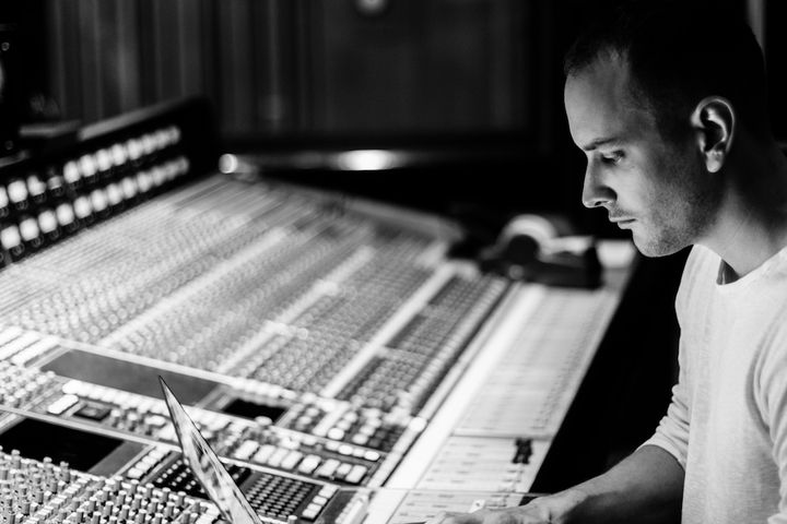 Axiden working in studio on tracks for Honua artists.