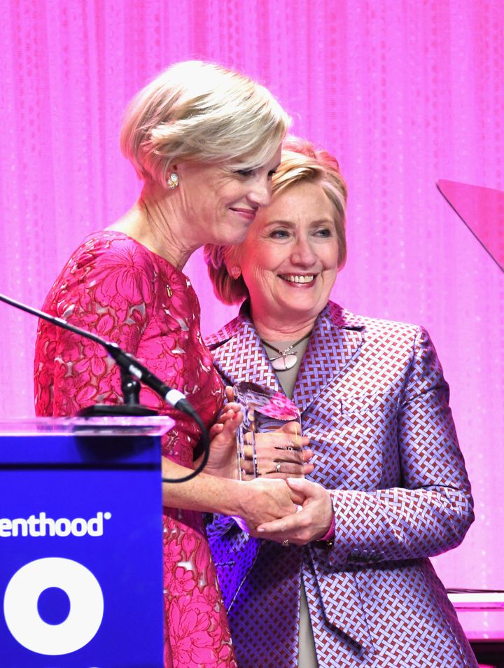 President of the Planned Parenthood Federation of America, Cecile Richards (L) presents event honoree Hillary Clinton with her award during the Planned Parenthood 100th Anniversary Gala at Pier 36 on May 2 in NYC. 