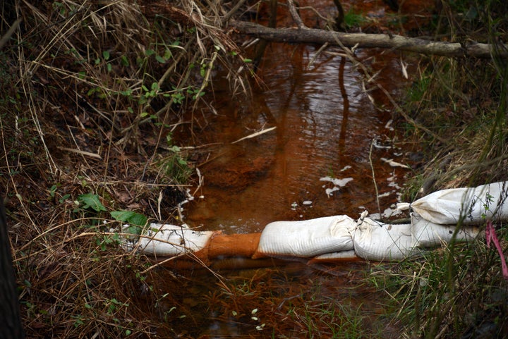 Coal-ash-contaminated water colorized from heavy metals. Coal ash is loaded with cancer causing chemicals and can l