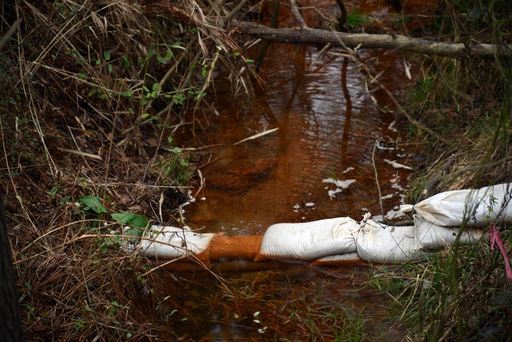 Coal-ash-contaminated water colorized from heavy metals. Coal ash is loaded with cancer causing chemicals and can lead to developmental disorders and reproductive problems.