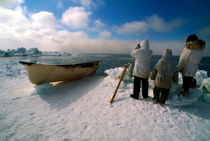 Men of the Edwardsen crew look for whales in April 2001 in the outskirts of Barrow, Alaska.