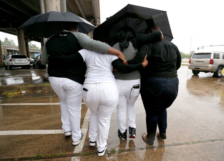 Relatives of Alton Sterling leave a news conference outside the Federal Court House in Baton Rouge, Louisiana, on Wednes