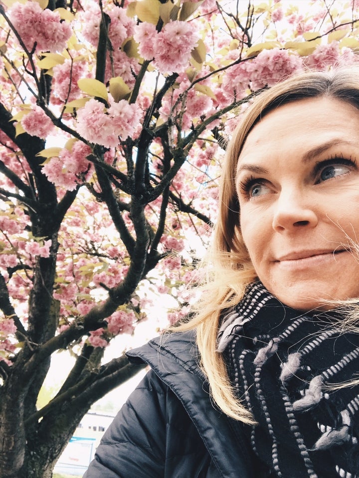 <p>Admiring the spring blossoms; a symbol of rebirth and new life.</p>
