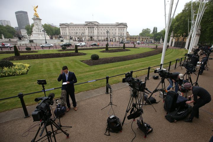 Television crews gather outside Buckingham Palace on Thursday morning