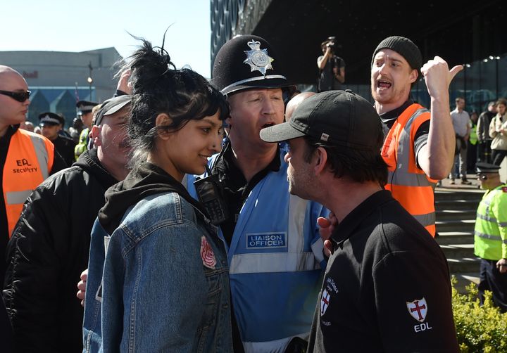Saffiyah Khan (left) faces down English Defence League (EDL) protester Ian Crossland