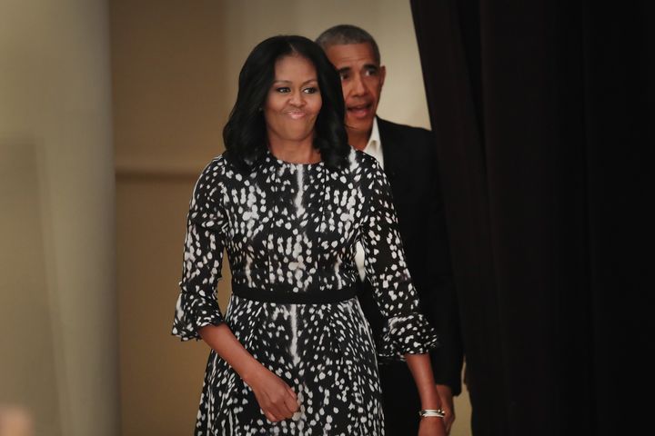 Former U.S. president Barack Obama and first lady Michelle Obama arrive to talk about the Obama Presidential Center during a community event at the South Shore Cultural Center on May 3 in Chicago, Illinois.