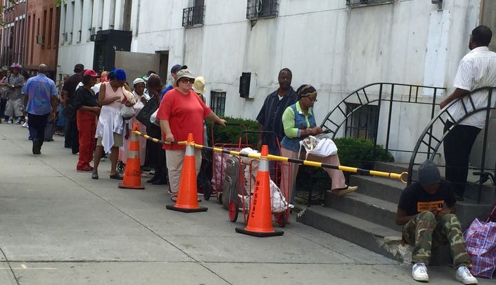 People waiting on a line to get free food from a community food pantry in Brooklyn, New York.