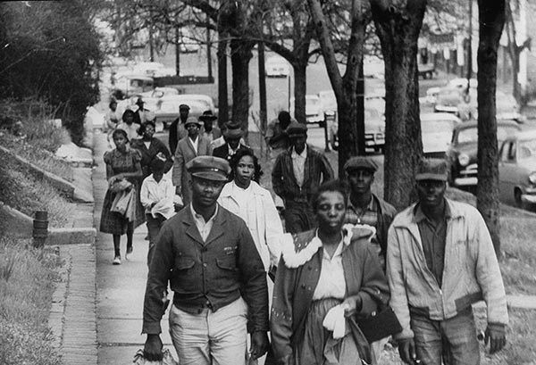 <p>Walking to work, 1956. Thousands of black commuters are shown walking long distances to work instead of riding buses during the Montgomery busboycott, 1956.</p>