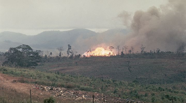 Napalm bombs and 250-pound snake eye bombs are shown as they go off in Khe Sahn, Vietnam. February, 1968.