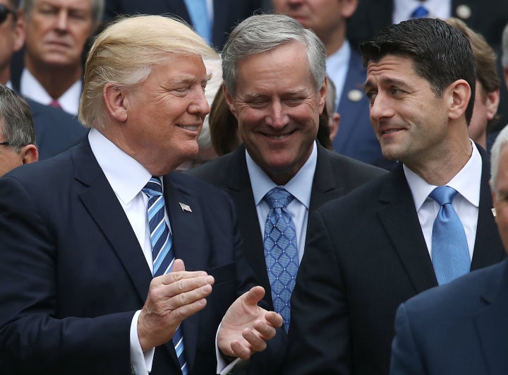 U.S. President Donald Trump (L), stands with House Speaker Paul Ryan (R-WI) (R) and Freedom Caucus Chairman Mark Meadows (R-NC), after Republicans passed legislation aimed at repealing and replacing ObamaCare on May 4, 2017 in Washington, DC.