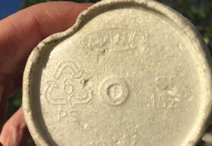 Polystyrene #6 resin code on the bottom of an EPS cup. Contrary to popular belief, the chasing arrows code does not mean that the material is recyclable, it just identifies the resin type. 