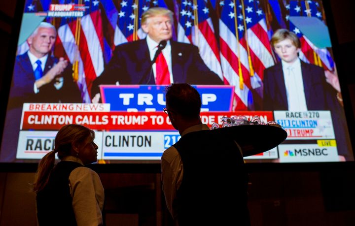 UNITED STATES - NOVEMBER 8: A stunned crowd, including the hotel staff, at the Nevada Democrats' election night watch party at the Aria Hotel & Resort in Las Vegas watch as Donald Trump delivers his victory speech after being elected the 45th President of the United States on Election Day, Nov. 8, 2016.