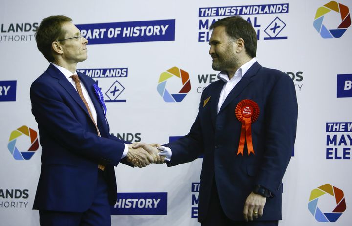 Tory Andy Street congratulated by Labour's Sion Simon.