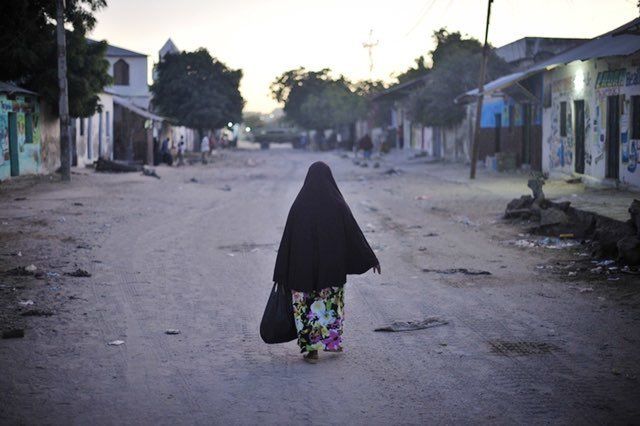 A woman walks down the street of Somalia’s capital, Mogadishu. Rape is underreported and rarely prosecuted in Somalia, but new legislation could help.