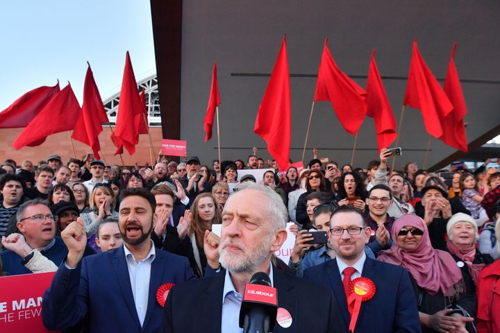 There were a sea of red flags behind Corbyn as he spoke