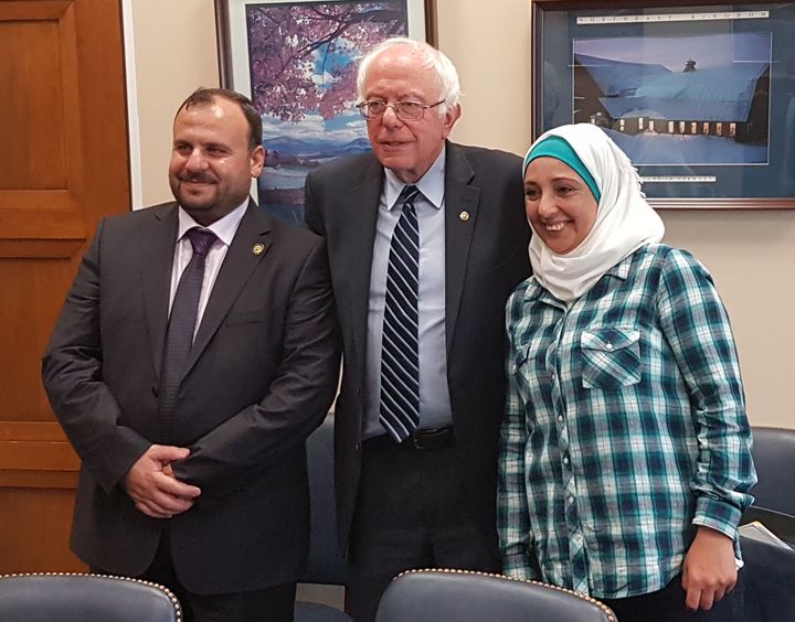 White Helmets leader Mounir Mustafa, left, and volunteer Manal Abazeed meet with Sen. Bernie Sanders (I-Vt.) on April 25 in Washington. It was Sanders' first meeting with the Syrian group.