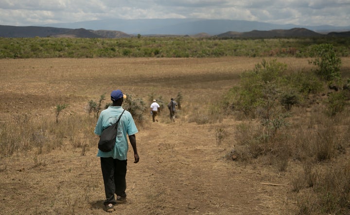Hiking through the Kenyan bush, en route to the Utut Forest caves.