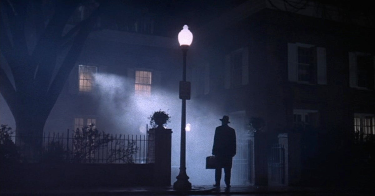 Night scene with a man in front of a vampire manor