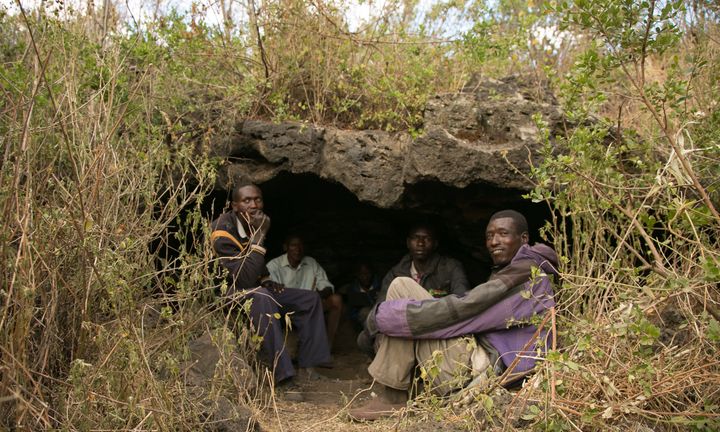 A group of friends in Kenya's remote Utut Forest, where 300 people live in caves. An outbreak of cutaneous leishmaniasis has plagued the local community.