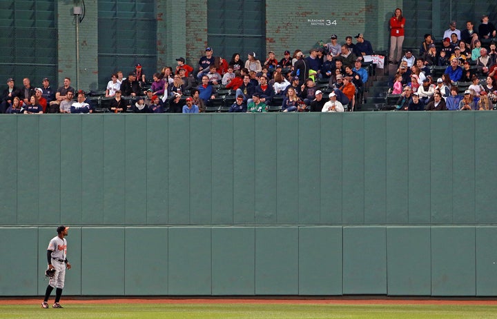 Adam Jones is pictured as he looks up into the centerfield bleachers.