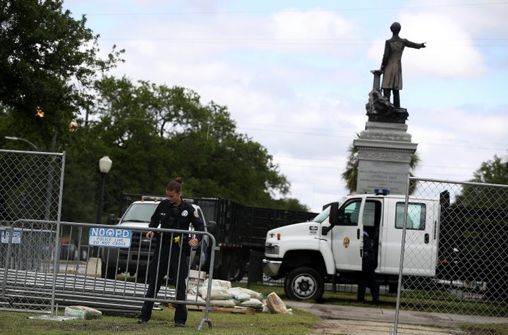 New Orleans police officers set up barricades at the Jefferson Davis monument on May 4, 2017 in New Orleans, Louisiana.
