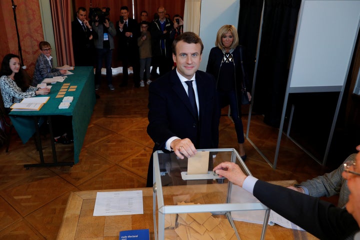 French presidential election candidate Emmanuel Macron casts his ballot. Opinion polls gave Macron a sizable lead before the vote.