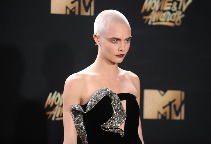 Cara Delevingne poses at the 2017 MTV Movie and TV Awards at The Shrine Auditorium on 7 May 7 2017 in Los Angeles, California.
