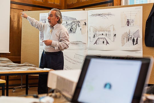 <p>Angaangaq Angakkorsuaq giving a presentation on the healing centre <em>Aanakasaap Illua</em>.</p>