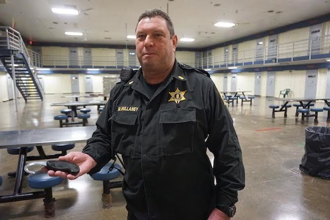 Corrections Officer Michael Mullaney shows cut-down tool to prevent suicides at Worcester County jail.