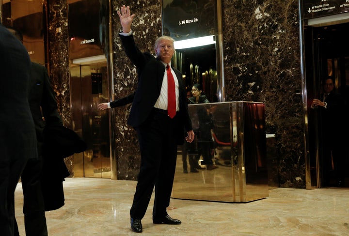 Donald Trump waves to supporters as he makes an appearance in the lobby at Trump Tower in New York on Jan. 13.