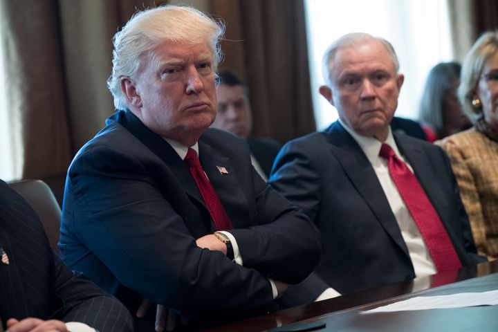 President Donald Trump and Attorney General Jeff Sessions at a White House discussion on March 29. Sessions' Justice Department has cited a ruling in a swimming pool closure case in its defense of the travel ban.