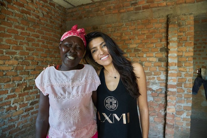 LXMI founder Leilah Janah, and one of the Ugandan war widows she's employed as her harvester