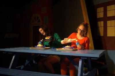 Tricia (Isabel Siragusa) and Marcy (Madison Worthington) get wasted during lunch in a scene from Dog Sees God 