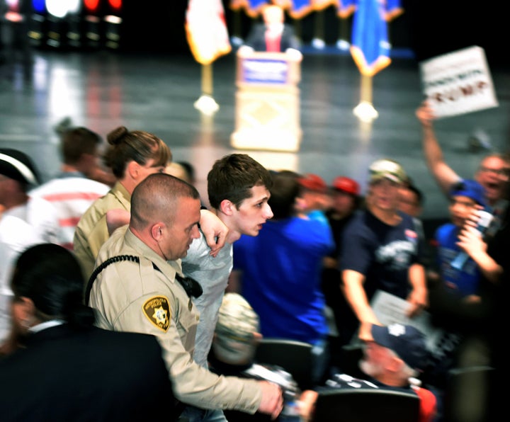 Michael Sandford, pictured, has told how he was hearing voices when he tried to grab a police officer's weapon during a Donald Trump rally during the US presidential election