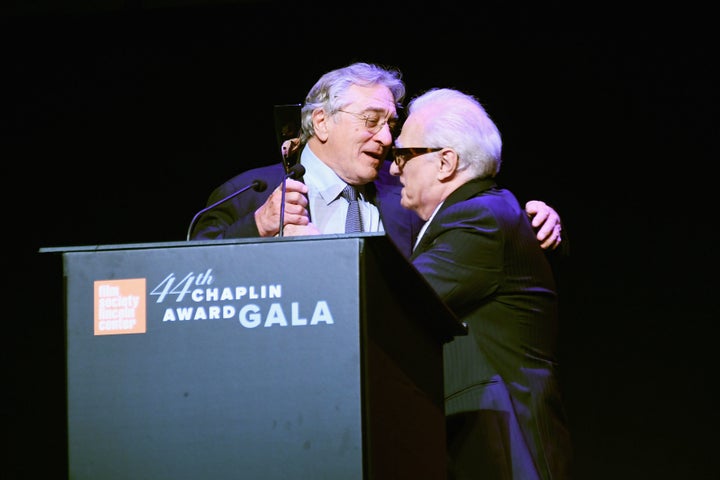 Director Martin Scorsese presents De Niro with his award.