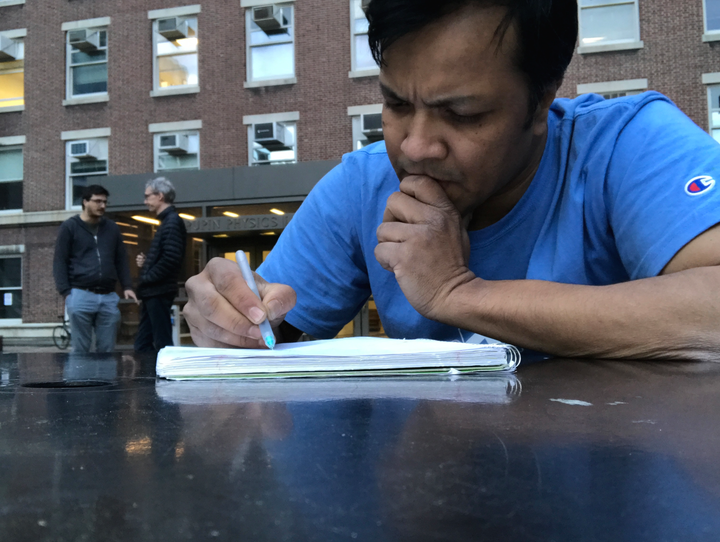 Rashidul Bari is writing a letter to Sazid Hasan.