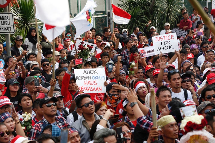 Supporters of Jakarta Governor Basuki Tjahaja Purnama, also known as Ahok, stage a protest outside Cipinang Prison, where he