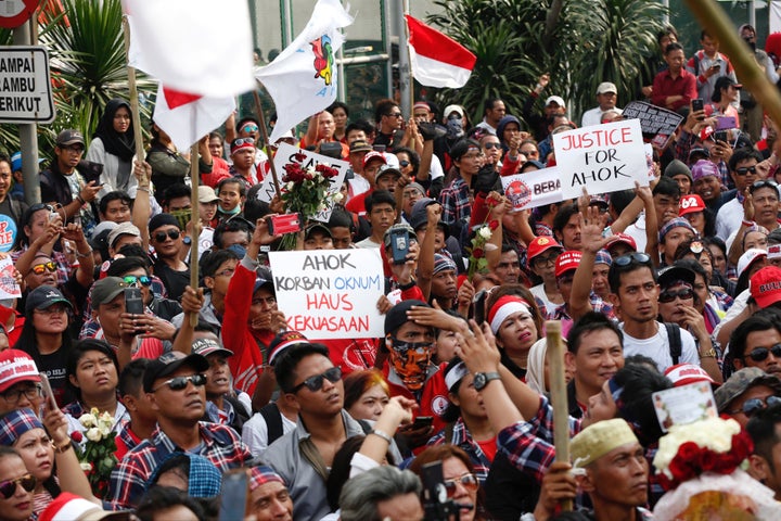 Supporters of Jakarta Governor Basuki Tjahaja Purnama, also known as Ahok, stage a protest outside Cipinang Prison, where he was taken following his conviction of blasphemy, in Jakarta, Indonesia May 9, 2017.