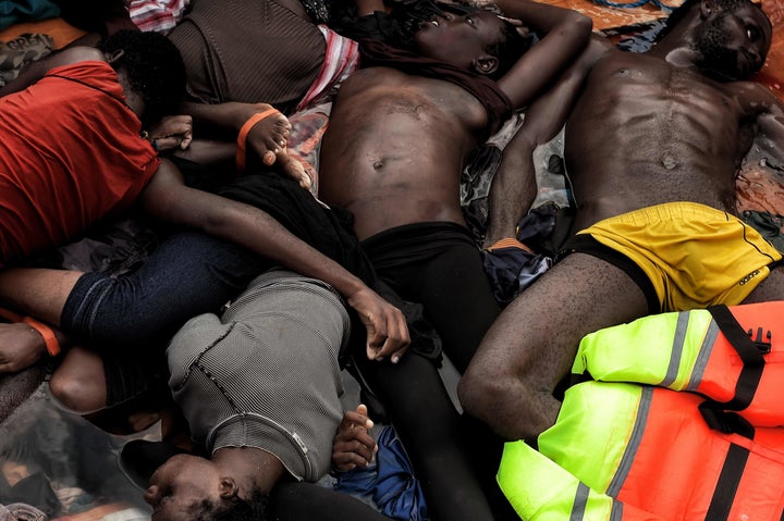 The bodies of refugees and migrants who died on a rubber boat lie on a boat in the Mediteranean Sea, north of Libya, on Octob
