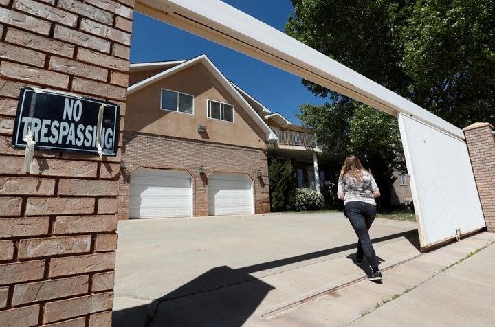 Briell Decker, the 65th wife of jailed Fundamentalist Church of Jesus Christ of Latter-Day Saints (FLDS Church) polygamist prophet leader Warren Jeffs, enters his compound, where he lived for several years, in Hildale, Utah, U.S., on May 3, 2017.