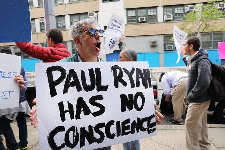 Protesters gather in front of a Harlem charter school before the expected visit of House Speaker Paul Ryan (R-Wis.).