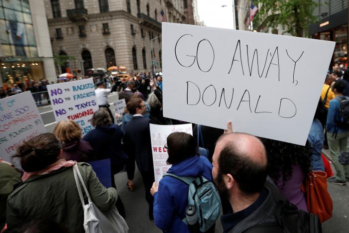<p>Protesters demonstrate near Trump Tower against U.S. President Donald Trump in the Manhattan borough of New York City, U.S. May 4, 2017. </p>