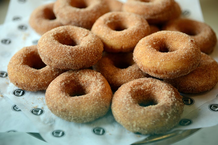 A beautiful pile of sugar-coated cake donuts.